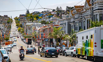 cars parked on street near buildings during daytime