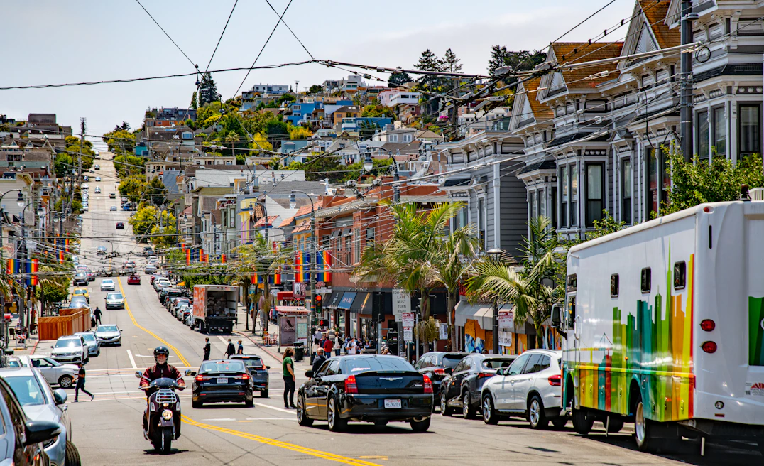 cars parked on street near buildings during daytime