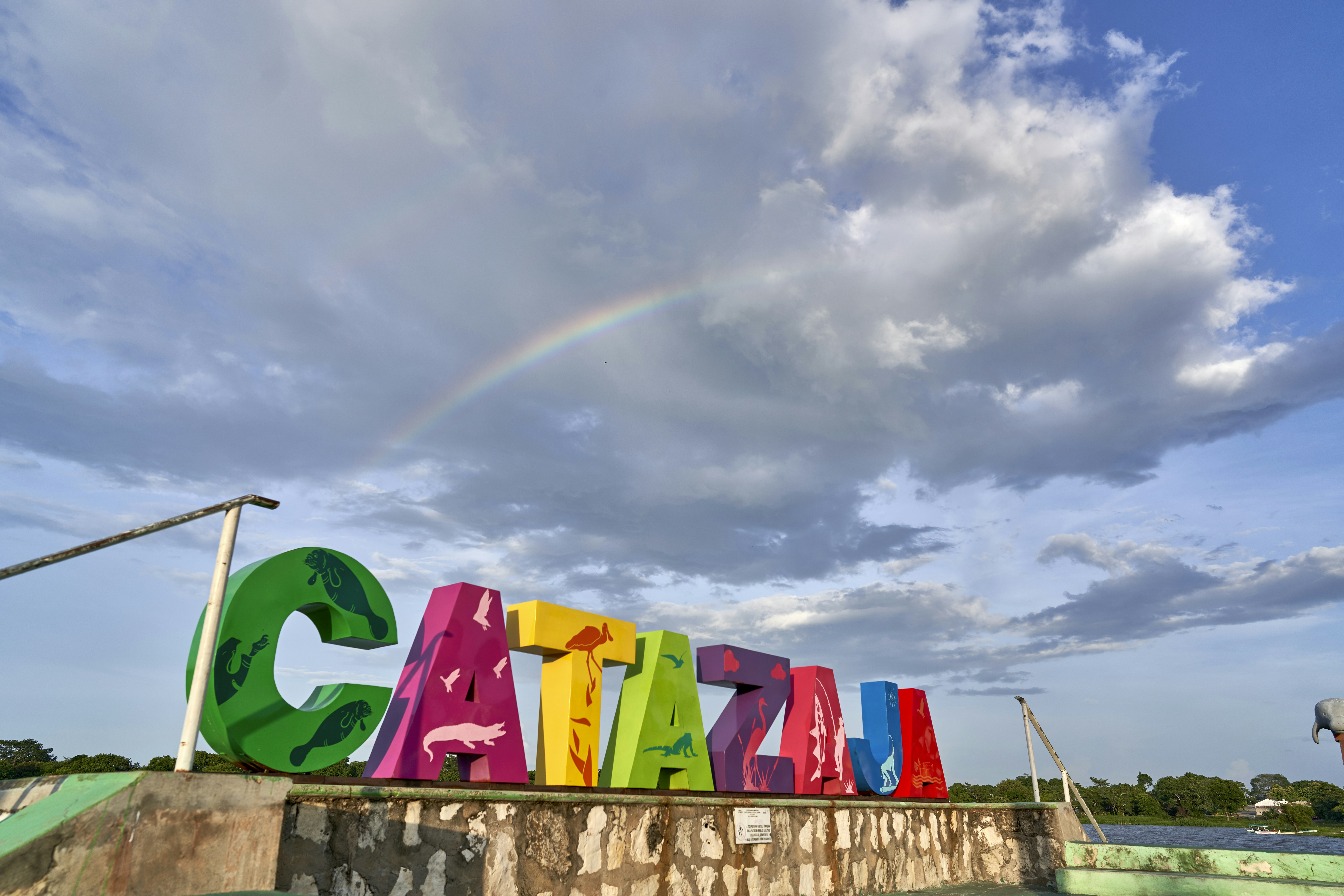 green and white concrete building under gray clouds