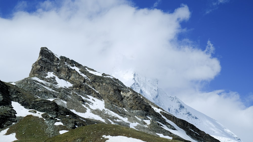 snow covered mountain under blue sky during daytime