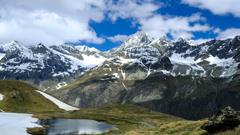 snow covered mountain under blue sky during daytime