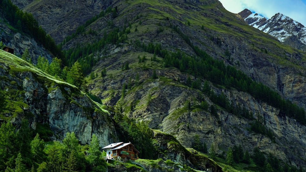 white and brown house on top of mountain