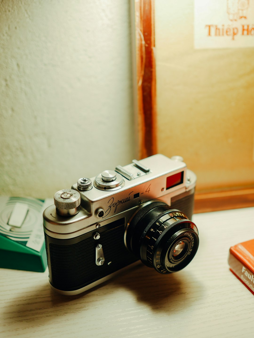 black and silver camera on brown wooden table