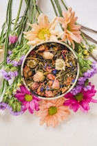 An assortment of fresh flowers and medicinal herbs commonly used in homeopathy