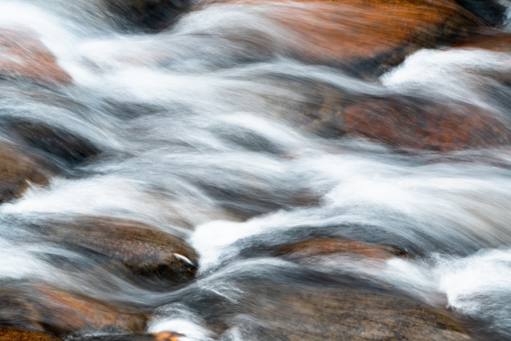 water falls in brown wooden surface