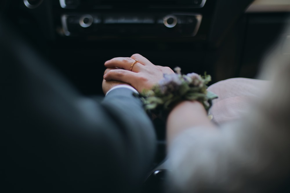 person holding green and white flower