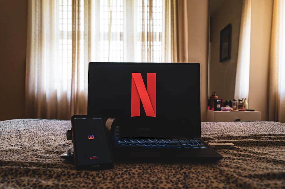 black laptop computer on table