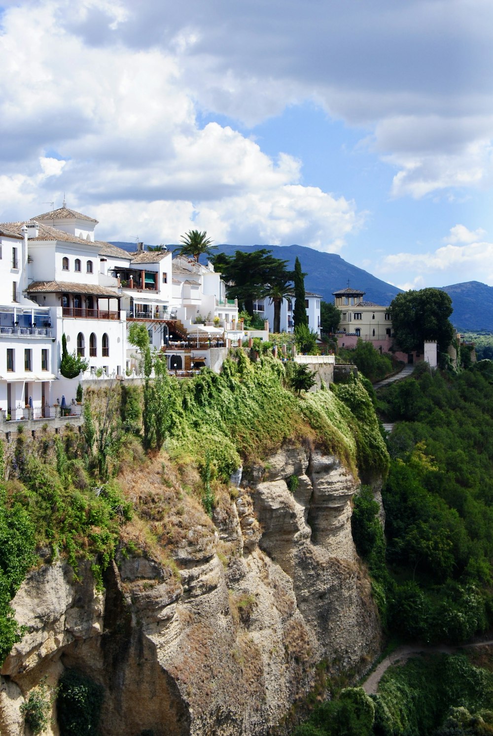 white concrete building on top of mountain during daytime