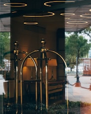 black metal stand near glass window