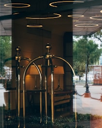 black metal stand near glass window