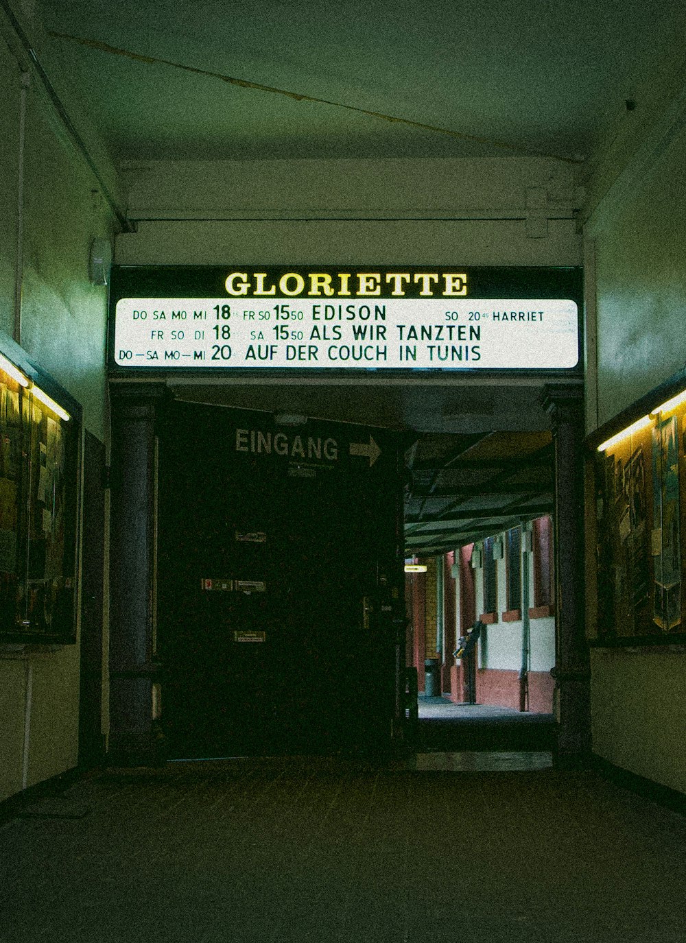 white and black signage on brown wooden door