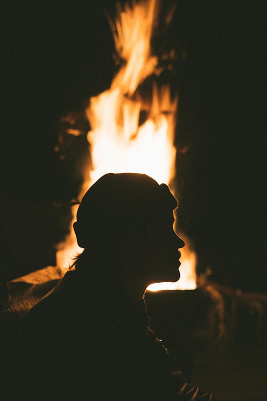 silhouette of man in front of bonfire in Perth WA Australia