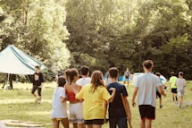 A diverse group of young people collaborating outdoors in a community setting.