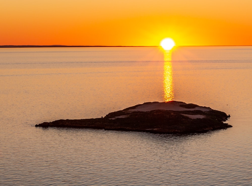 silhouette of lighthouse during sunset