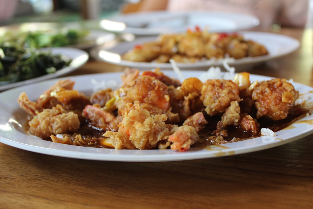 fried chicken on white ceramic bowl, The Fried Shrimp dipped in butter for the ultimate pleasure