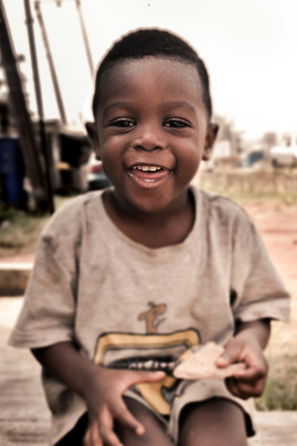 boy in gray crew neck t-shirt smiling