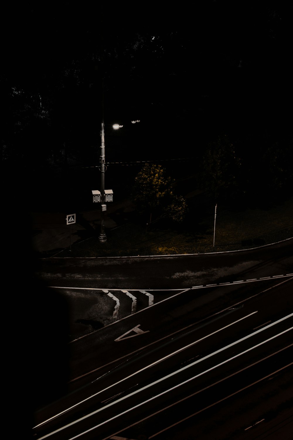 a traffic light on a street at night