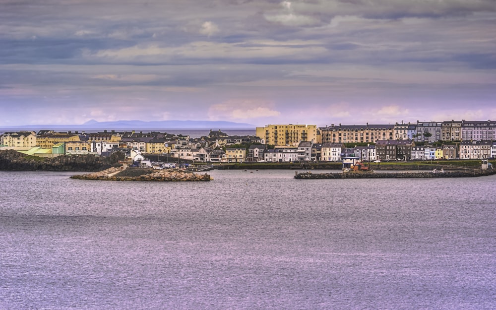 city skyline across body of water during daytime