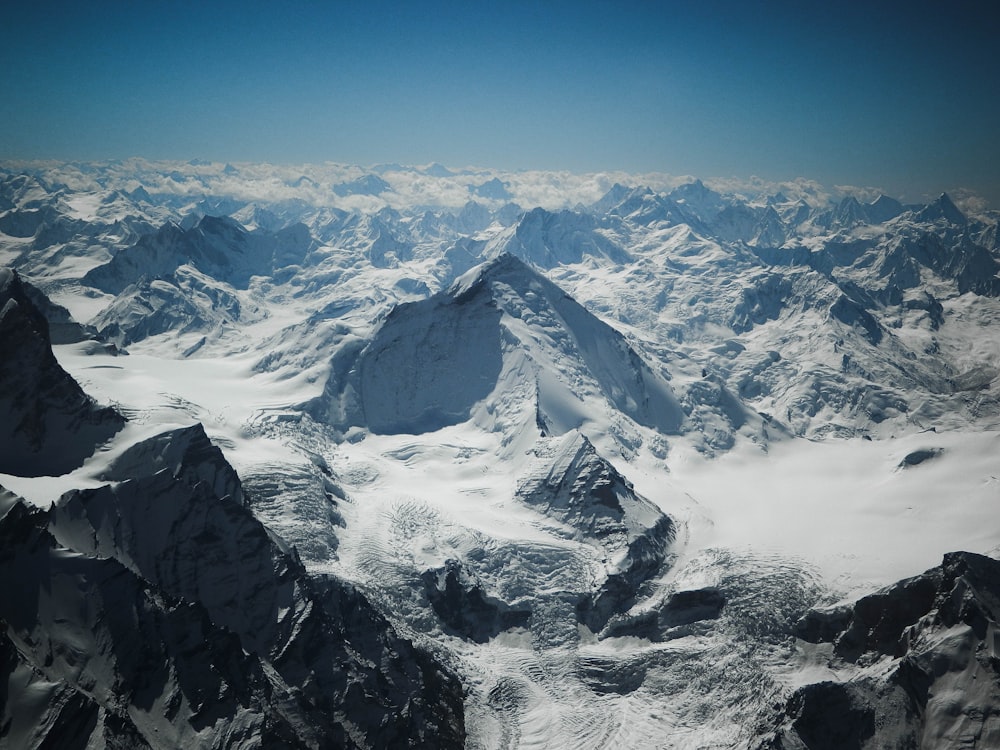 snow covered mountain under blue sky during daytime