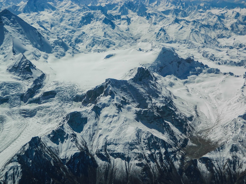 snow covered mountain during daytime