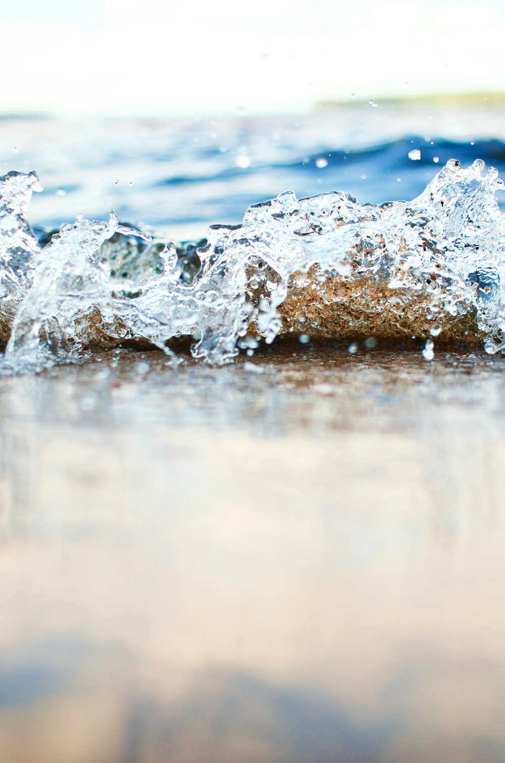 water splash on brown rock