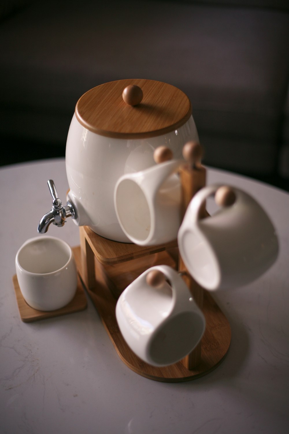 white ceramic mug on brown wooden table