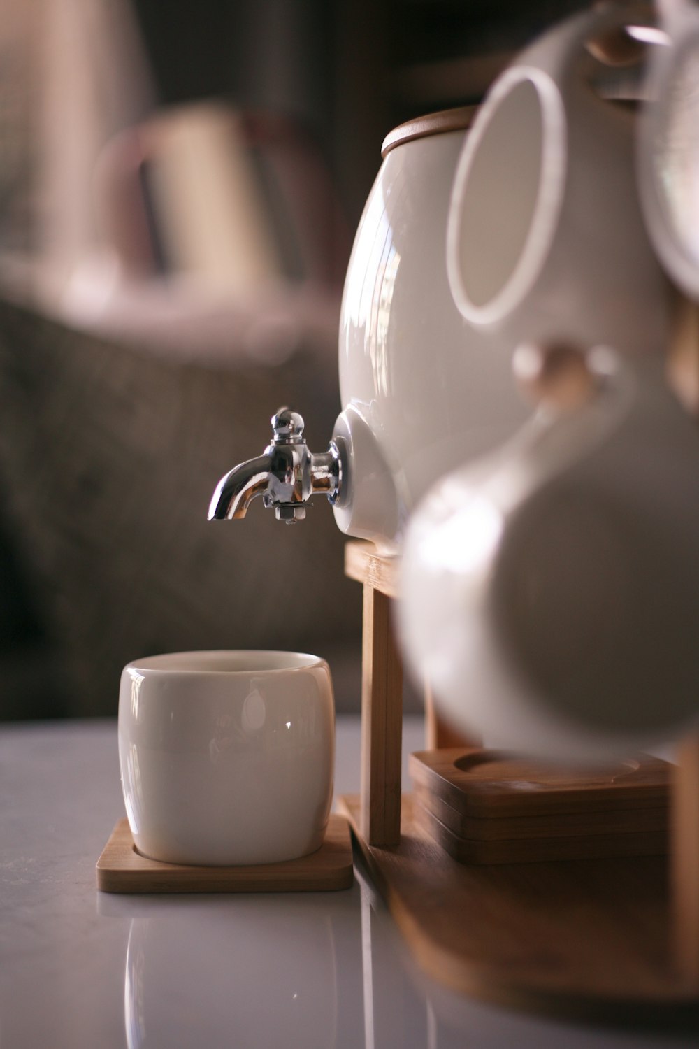 white ceramic mug on brown wooden table