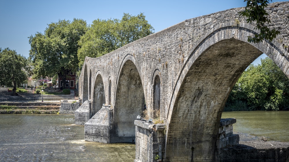 gray concrete bridge over river