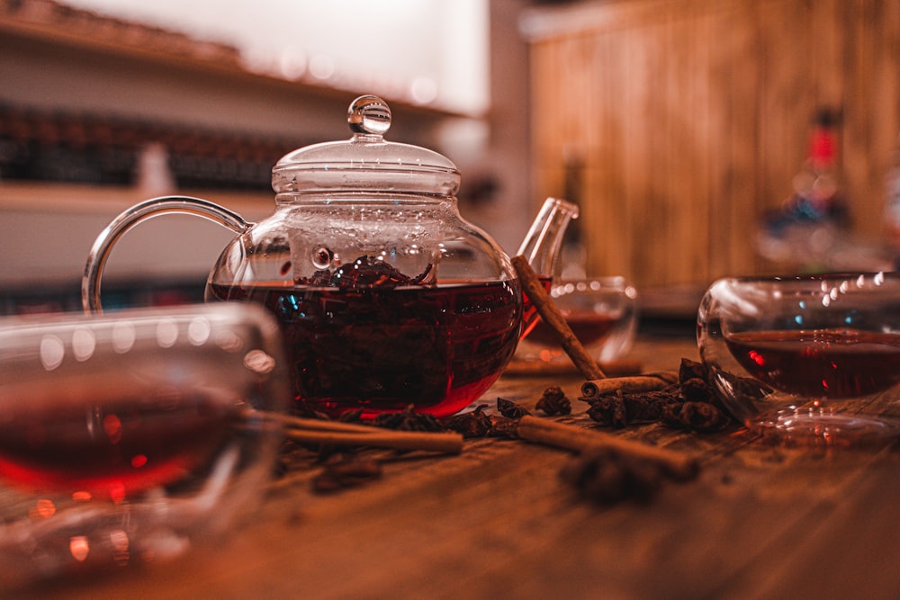 clear glass teapot on brown wooden table