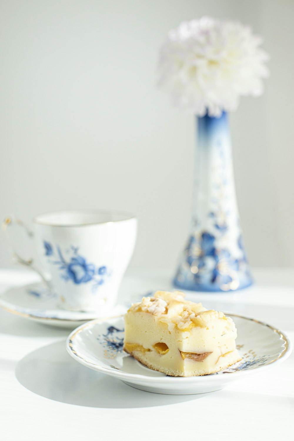 white ceramic cup on white saucer