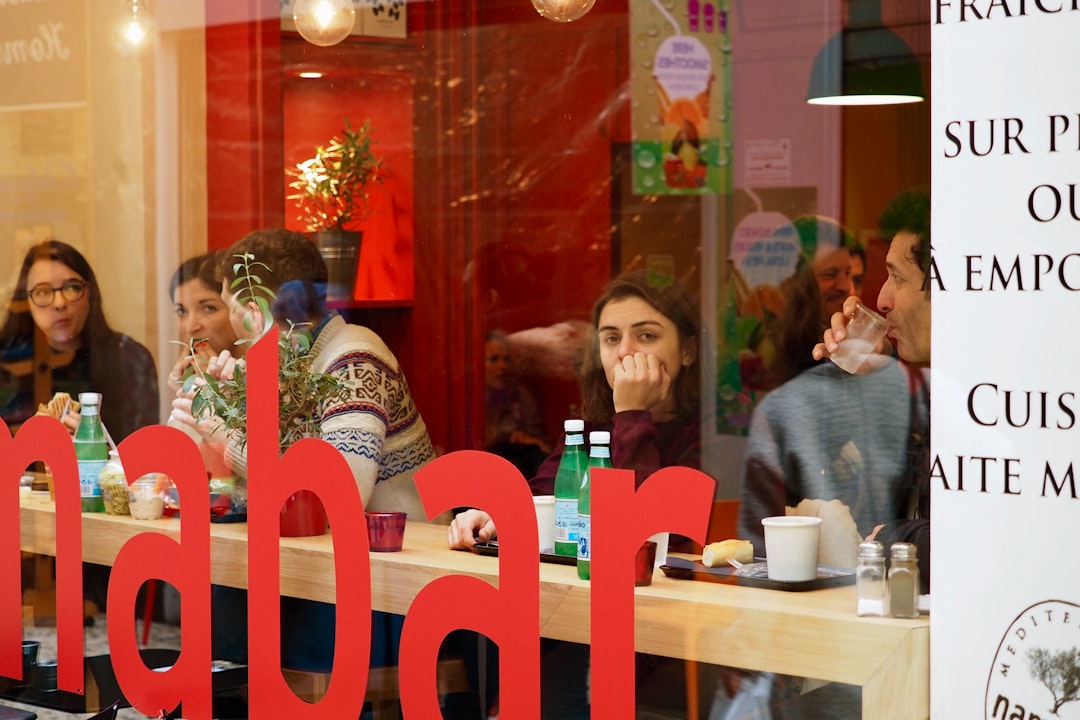 people sitting on chair in restaurant