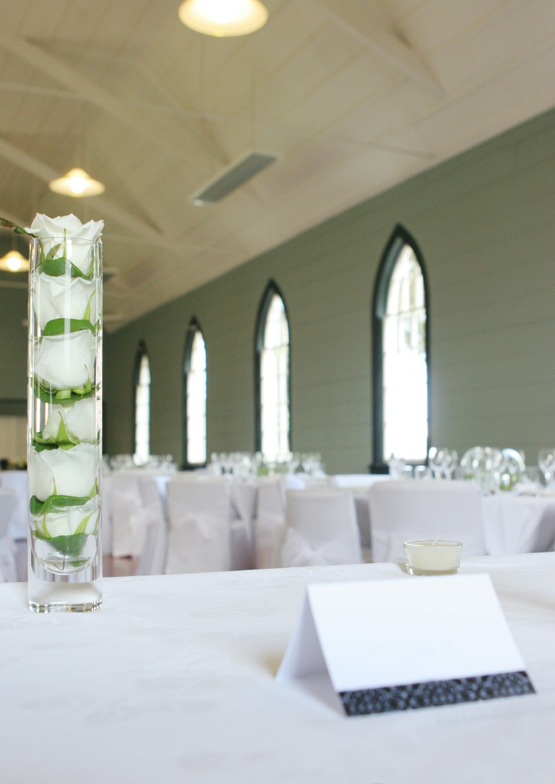 white and green glass bottles on table