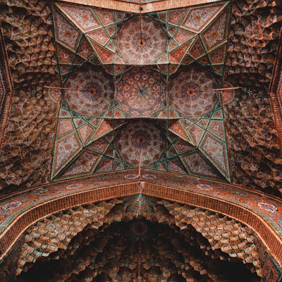 an intricately designed ceiling in a building