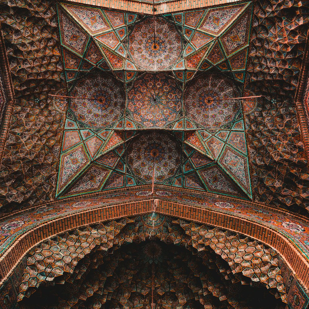 an intricately designed ceiling in a building