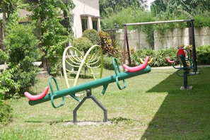 Outdoor playtime in a peaceful garden area surrounded by lush greenery at the school