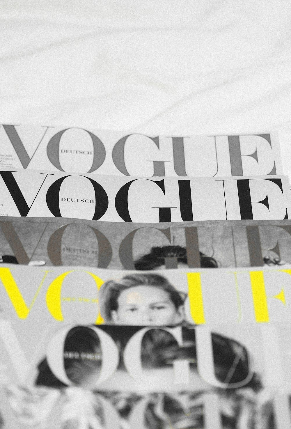 Fashion magazine covers and typography showcasing professional text in fashion imagery
