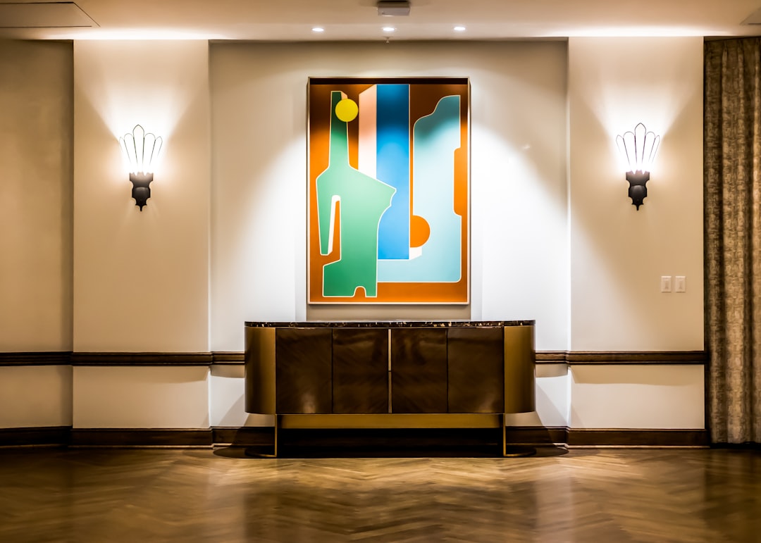 black flat screen tv on brown wooden tv rack, Hotel Lobbies.