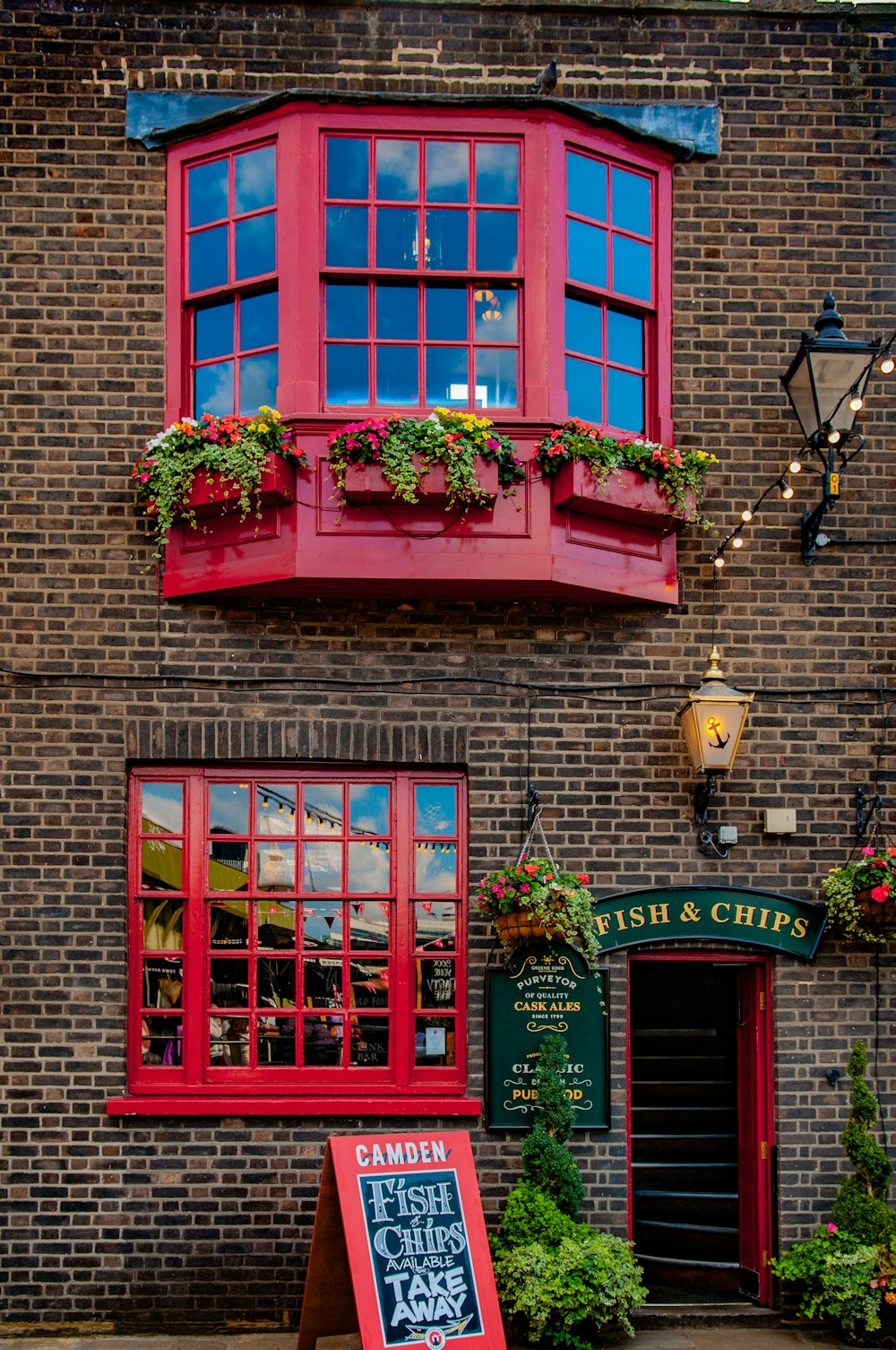 red wooden framed glass window