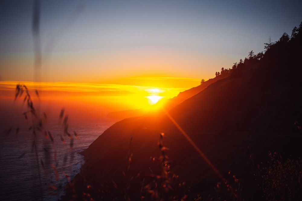 silhouette of mountain during sunset