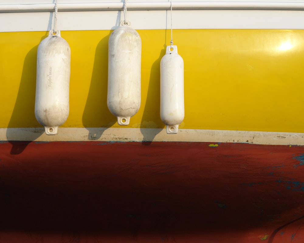 white hanging ornament on brown wooden wall