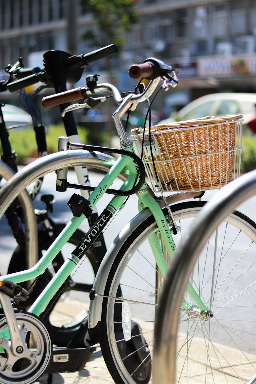 green city bike with brown woven basket