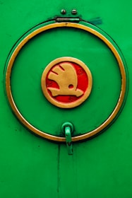Abstract green eye-shaped logo symbolizing vision, strategy, and sustainable growth.