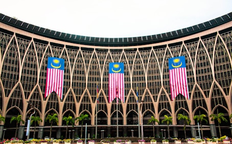 blue and white building with green trees