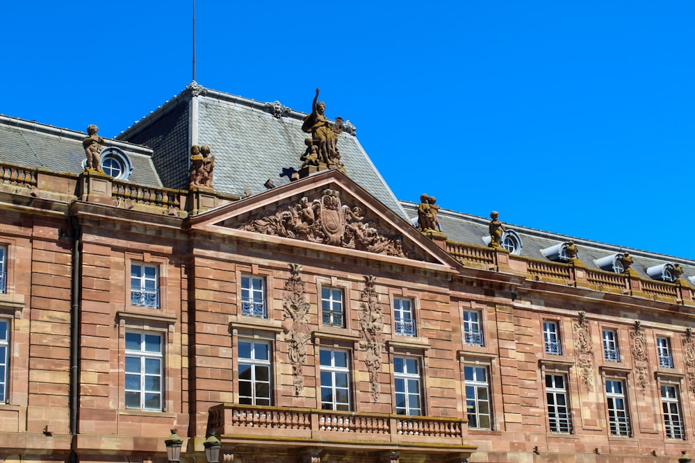 brown concrete building under blue sky during daytime