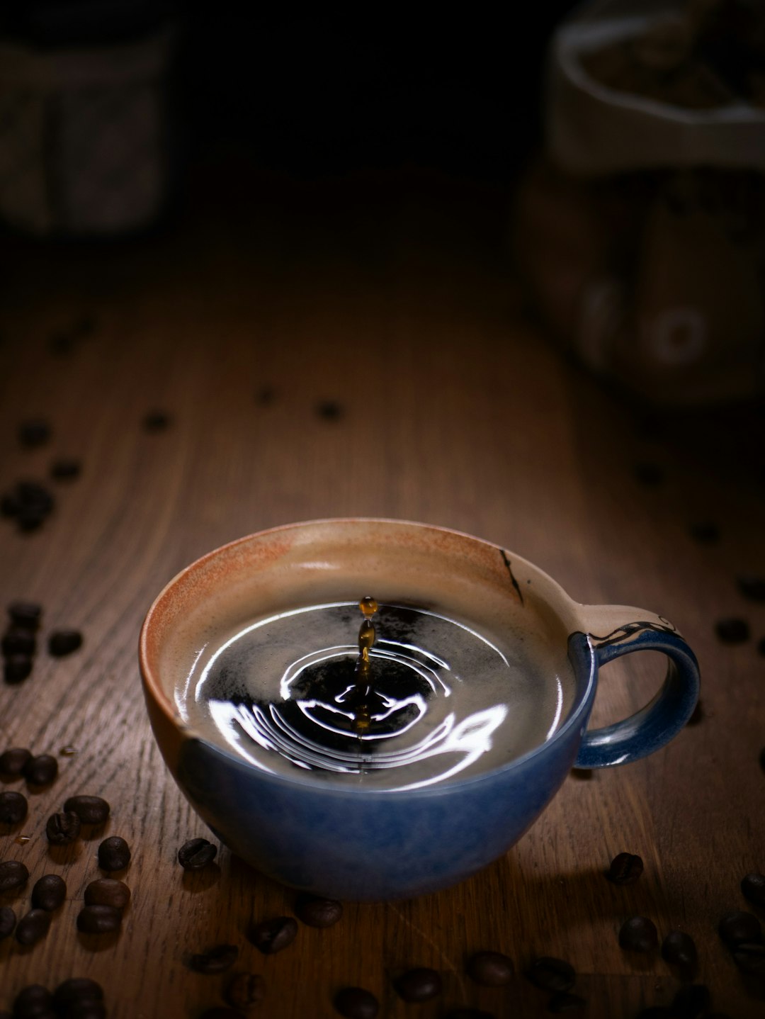 blue ceramic mug with coffee