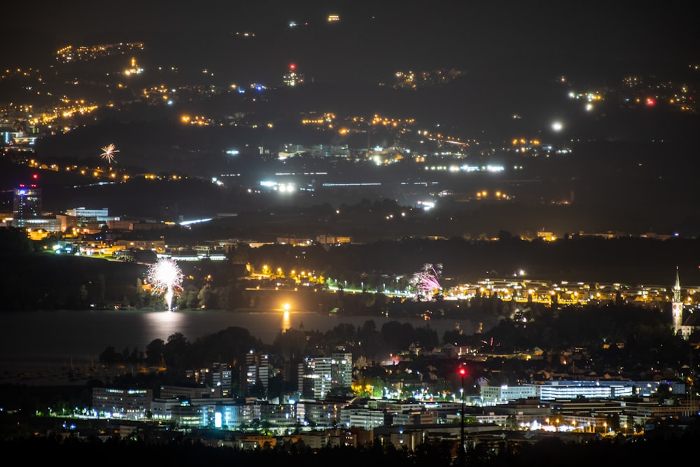 city with lights turned on during night time