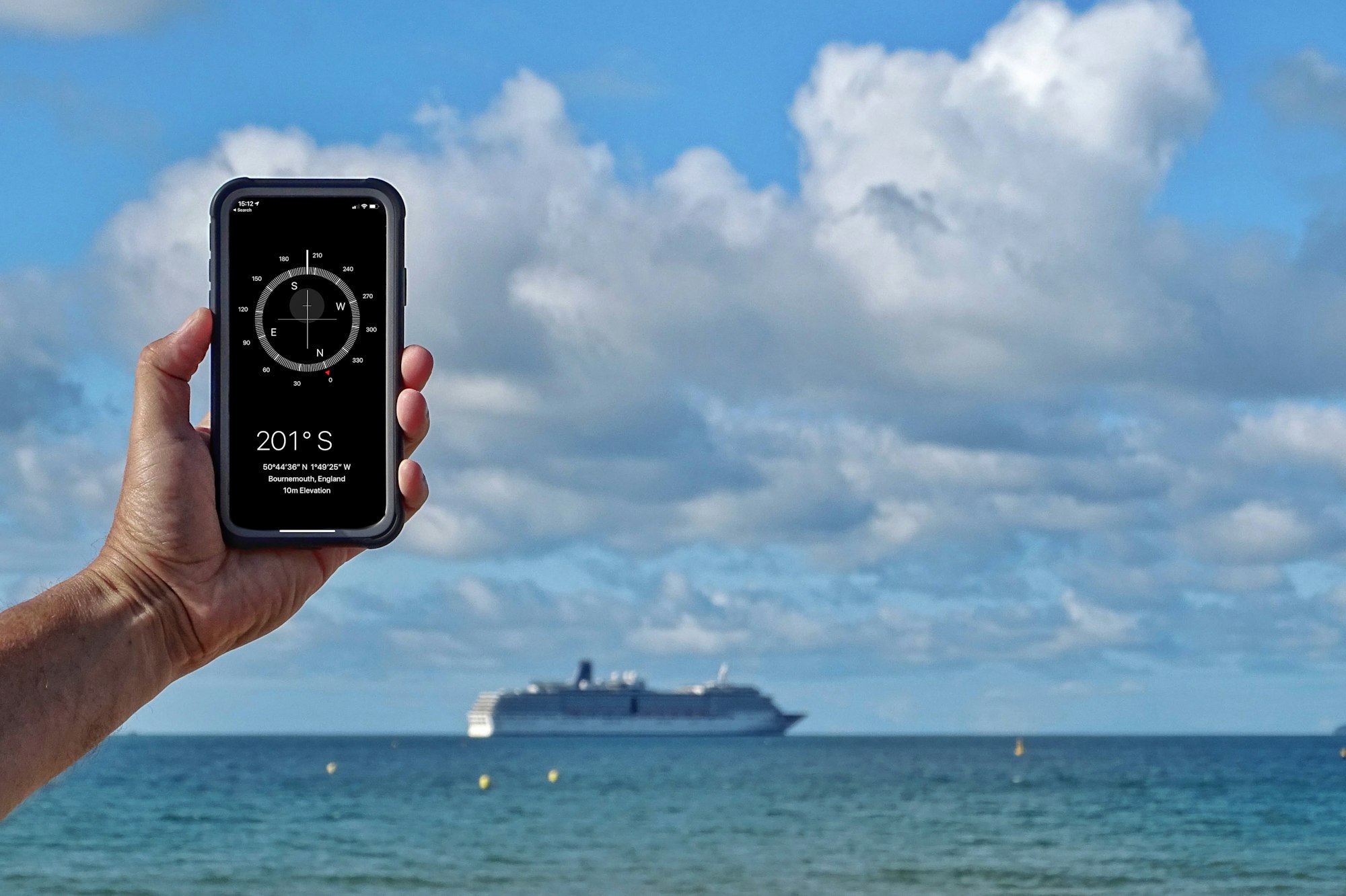 Checking the direction of a cruise ship in Bournemouth Bay, using the Compass App on an IPhone.