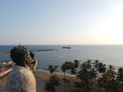 brown rock formation near body of water during daytime dominican republic teams background