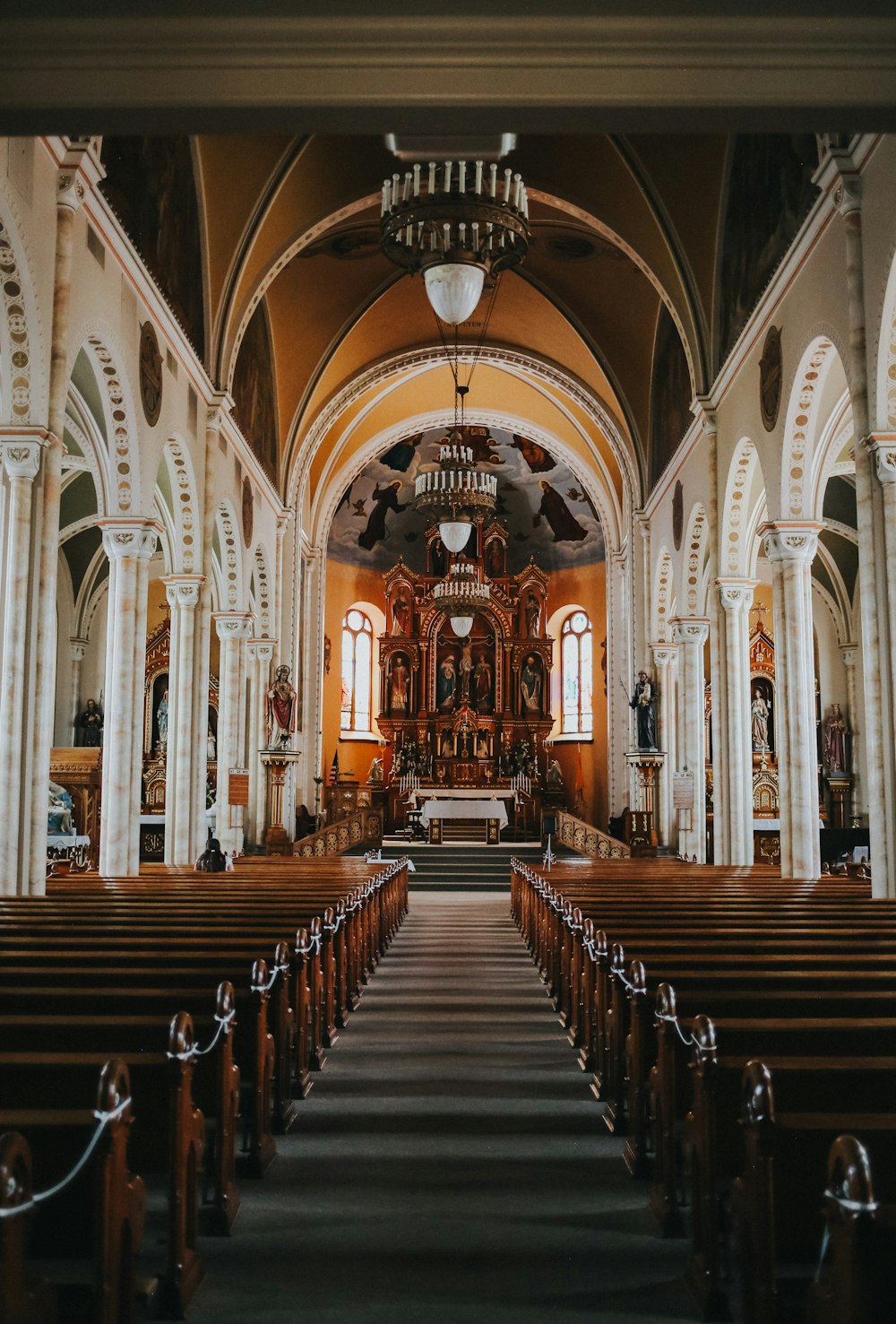 brown wooden bench inside cathedral