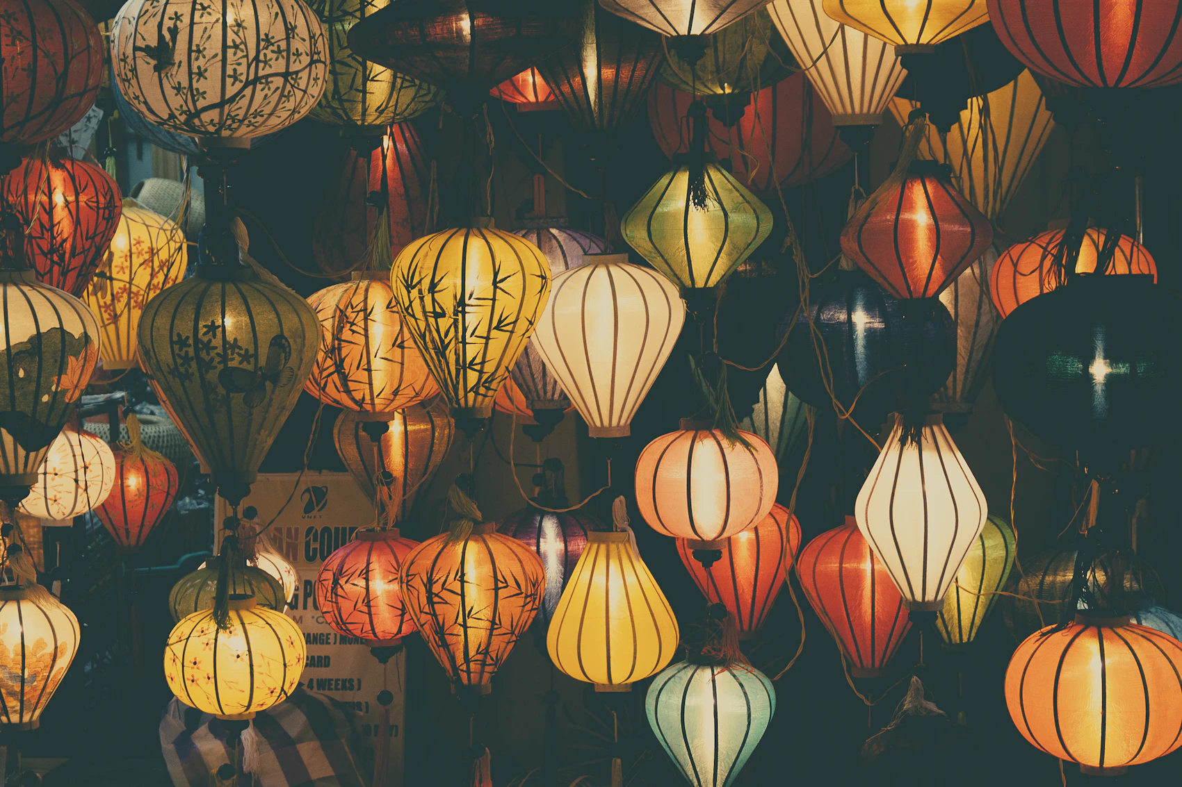 Handmade lanterns glowing in different colours in Hoi An